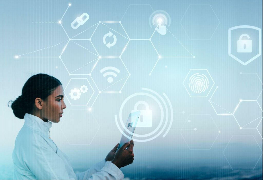 A female scientist in white, focusing on cybersecurity while typing on a tablet.