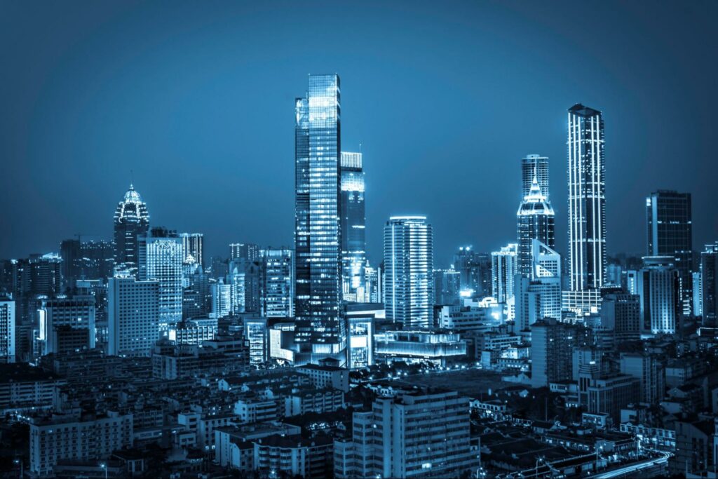 Cybersecurity for Critical Infrastructure: An image of a shimmering nighttime cityscape, symbolizing the practice of safeguarding industrial control systems and vital infrastructure from cyber threats.